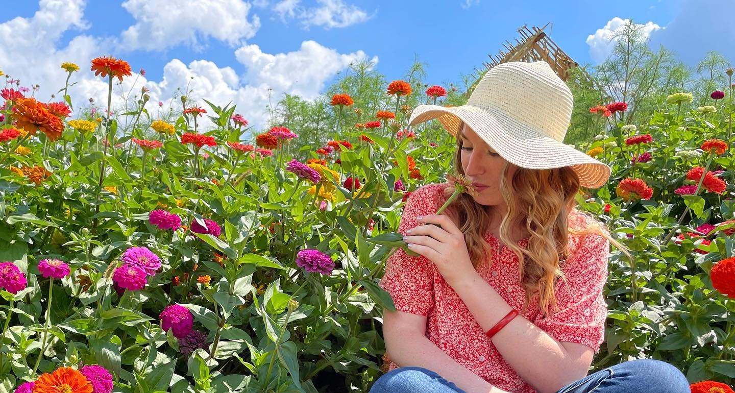 woman in field of flowers