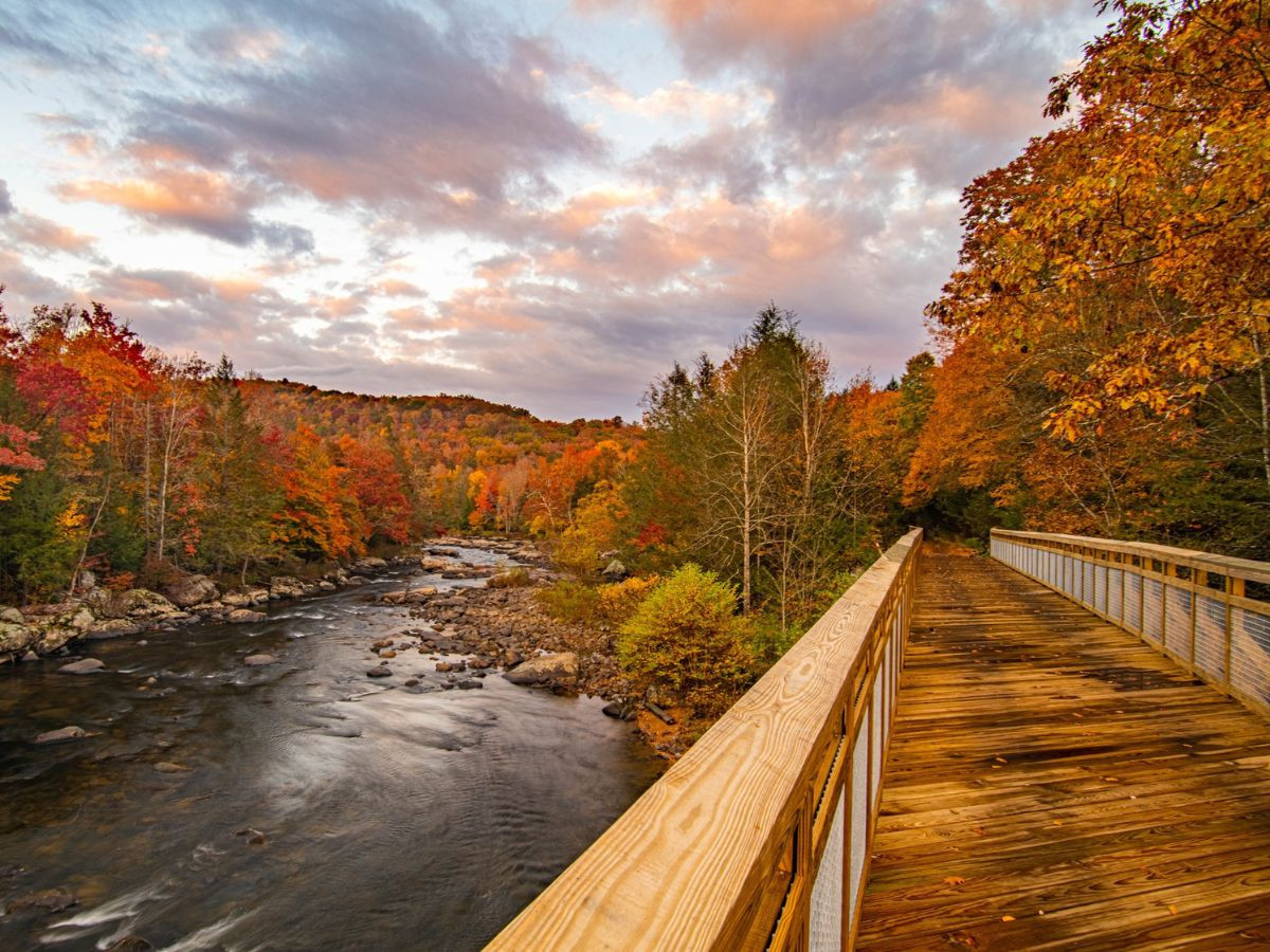Russellville Bridge on the Meadow River Rail Trail with Meadow River during fall