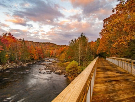 Russellville Bridge on the Meadow River Rail Trail with Meadow River during fall