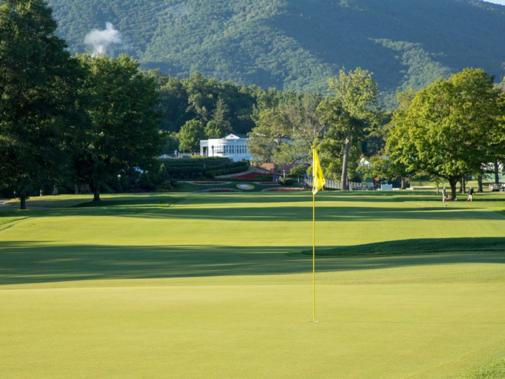 Golf course with yellow flag at The Greenbrier resort.