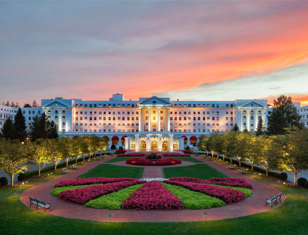 The Greenbrier Resort front with garden and trees.
