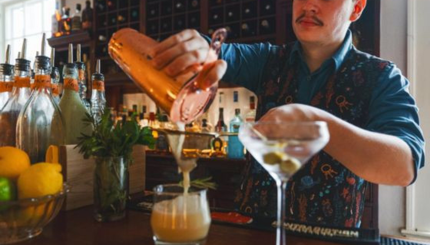 Bartender pouring drinks in Lewisburg, WV at the General Lewis Inn.