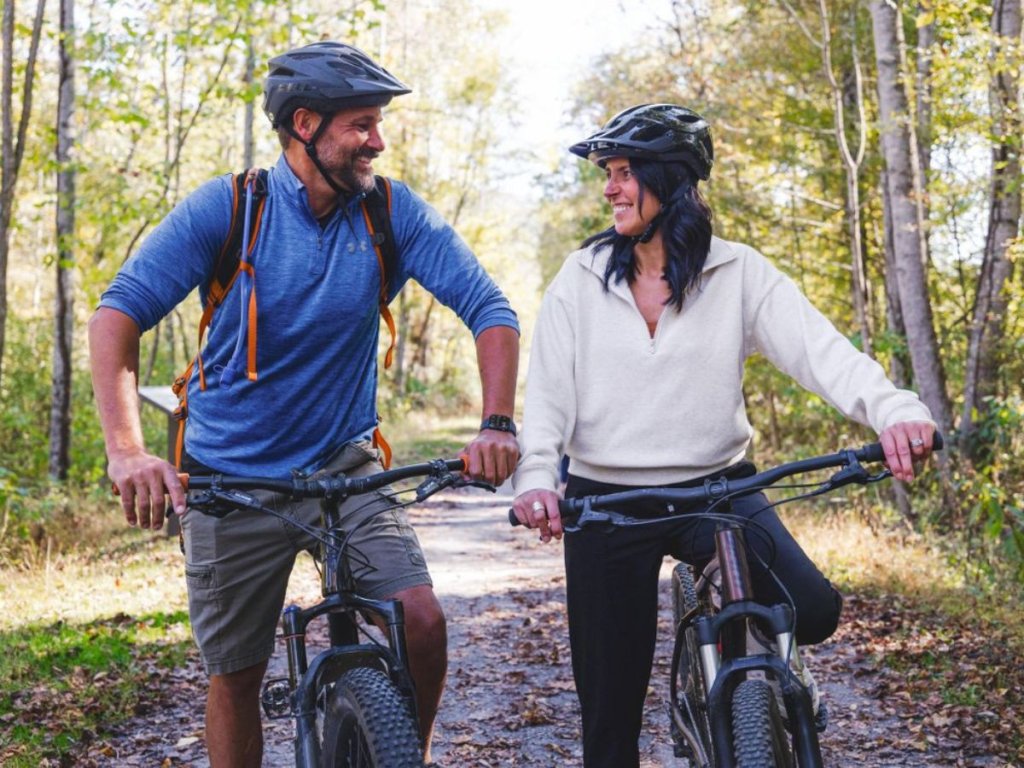 Couple biking on the Greenbrier River trail in Lewisburg, WV.